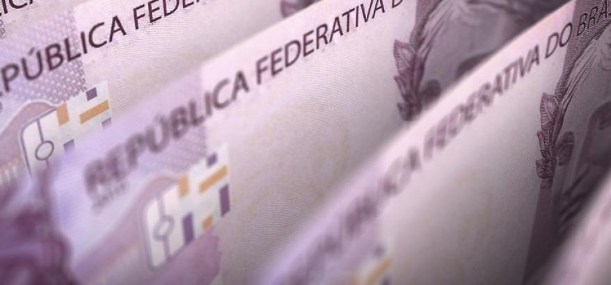 Imagem de cédulas de dinheiro sobrepostas, com o seguinte título: "CJF libera o pagamento de RPVs a mais de 125 mil beneficiários"